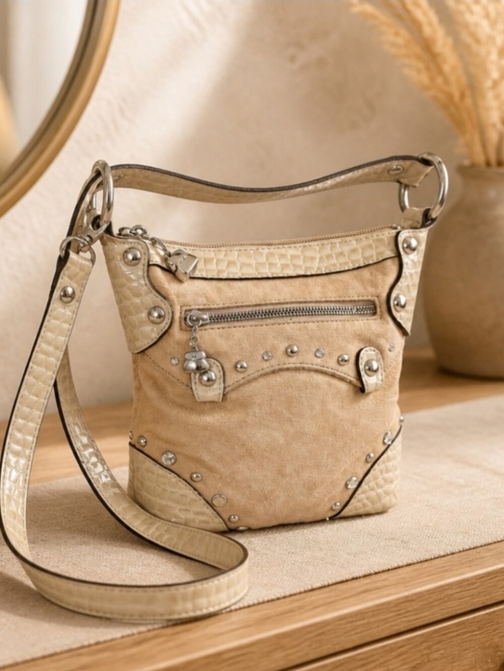 Kathy Van Zeeland crossbody in a creamy beige hue.